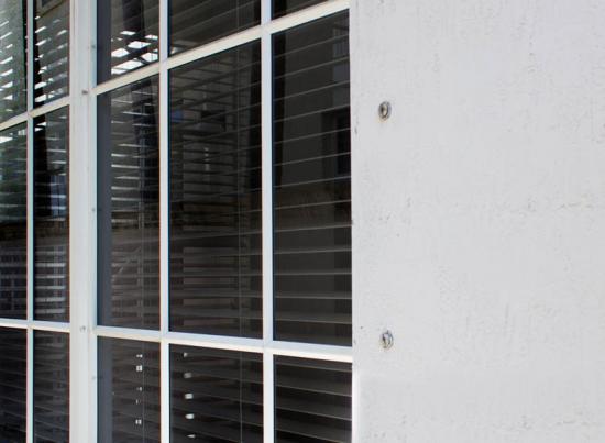 old windows with shutter bolt holes
