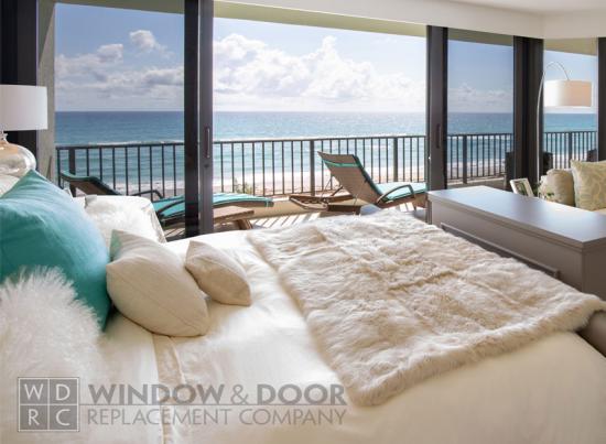 open sliding glass doors with an ocean view