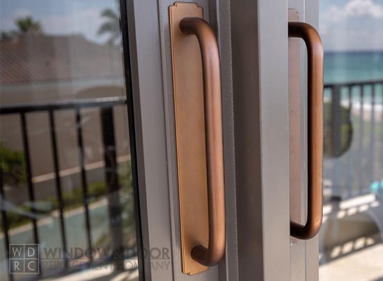 close up of sliding glass door hardware